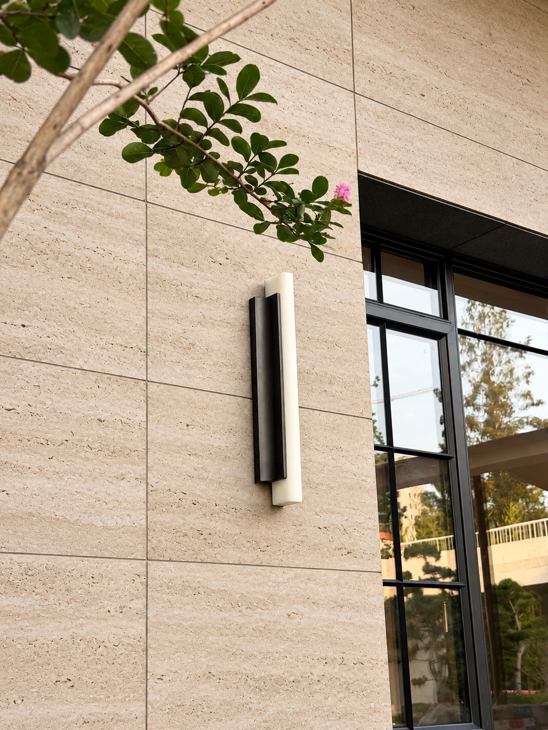 A blade of light on a travertine wall Image